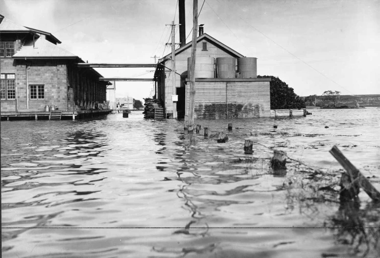 flood waters surround the water near homes