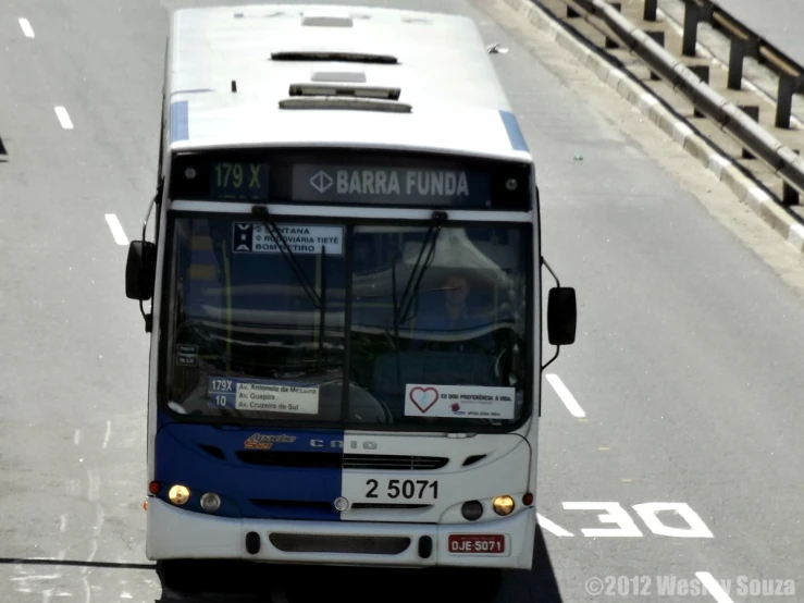 a transit bus parked along side of the road