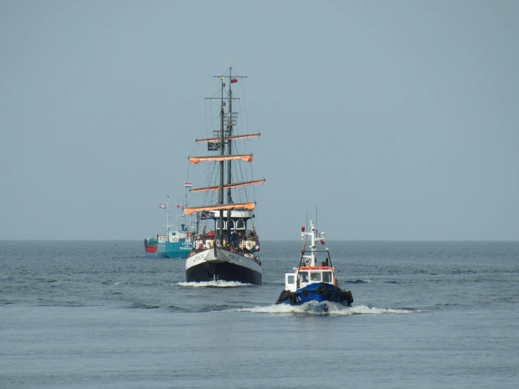 two boats that are in the water together