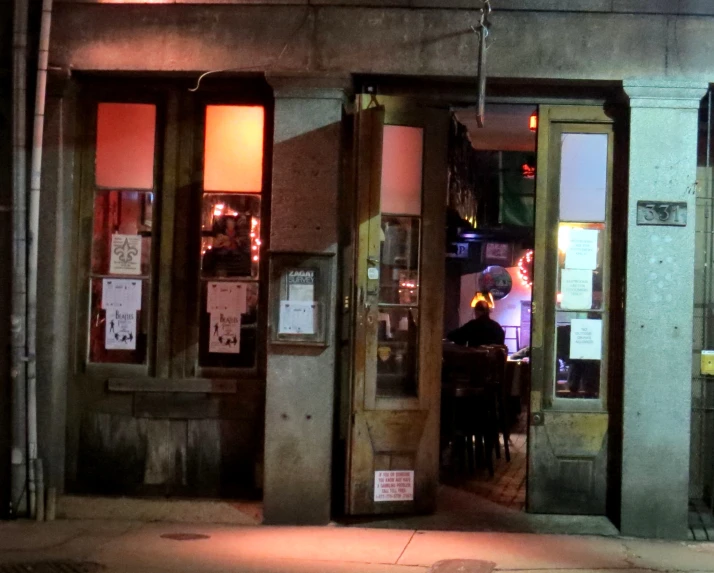 the doors to a restaurant and on a city street