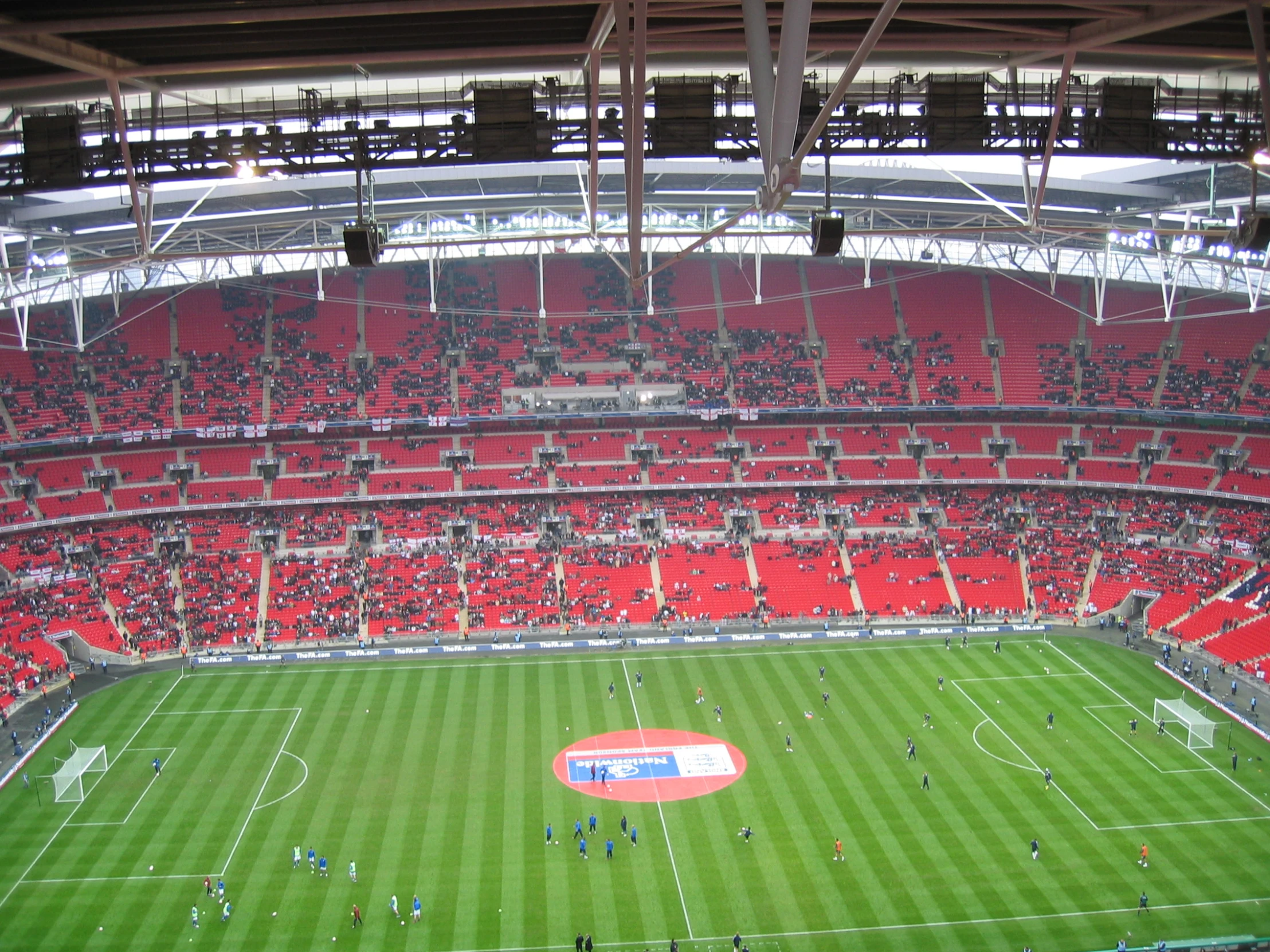 a soccer field filled with lots of people