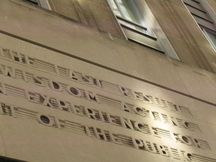 a close up of a building with the words in music on it