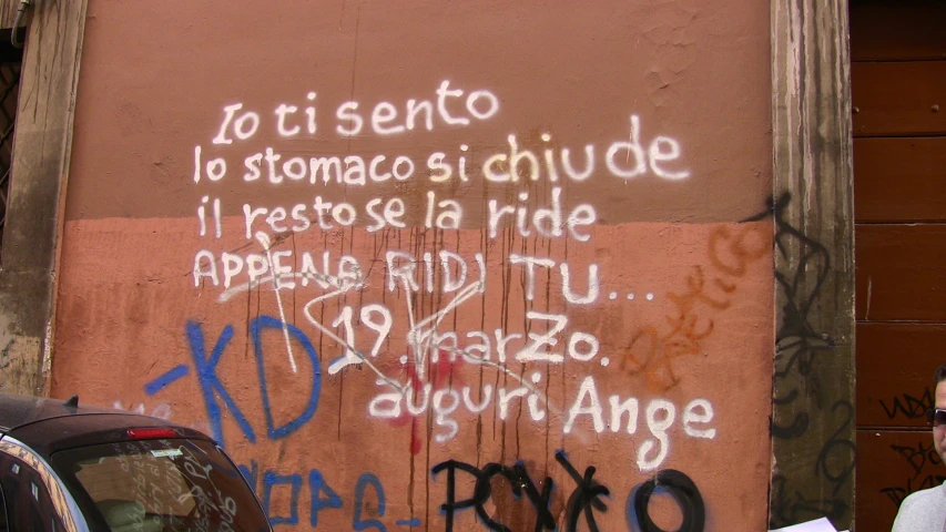 a wall with a few graffiti on it