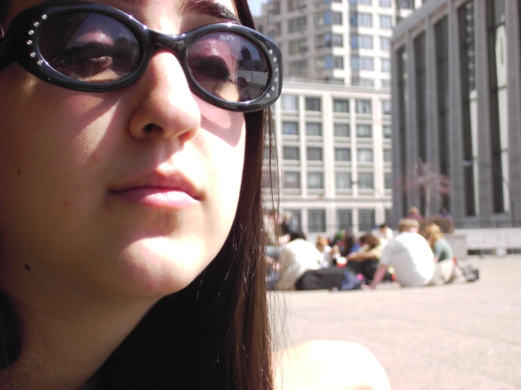 a close up of a person wearing a pair of eyeglasses