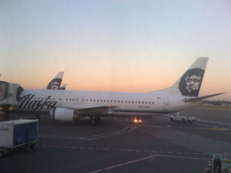 a large jetliner sitting on top of an airport runway