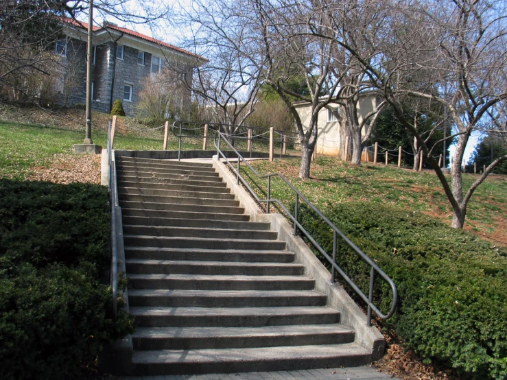 several concrete stairs leading down to a building