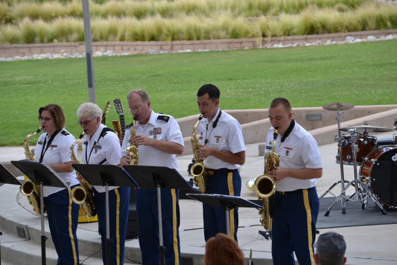 a group of people are playing instruments on a stage