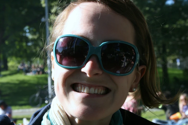 a close up of a person wearing large sunglasses