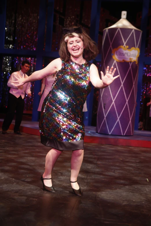 a person wearing a dress and holding up two hands in a dancing pose