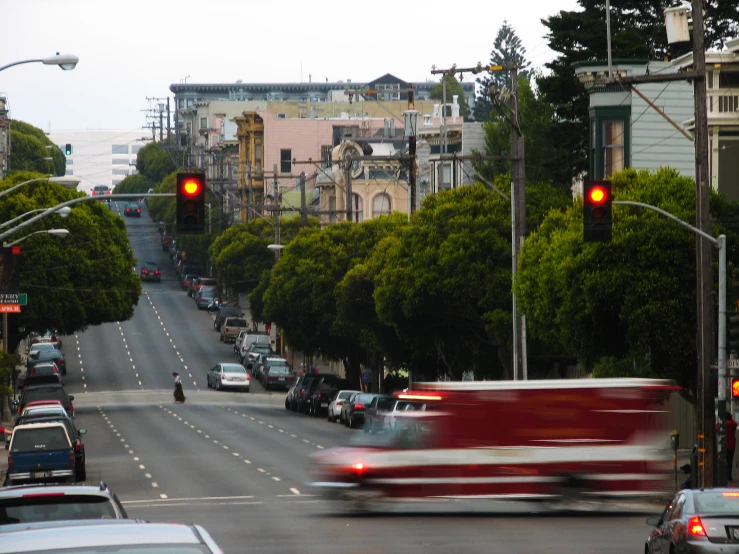 a truck travels down the road past other traffic