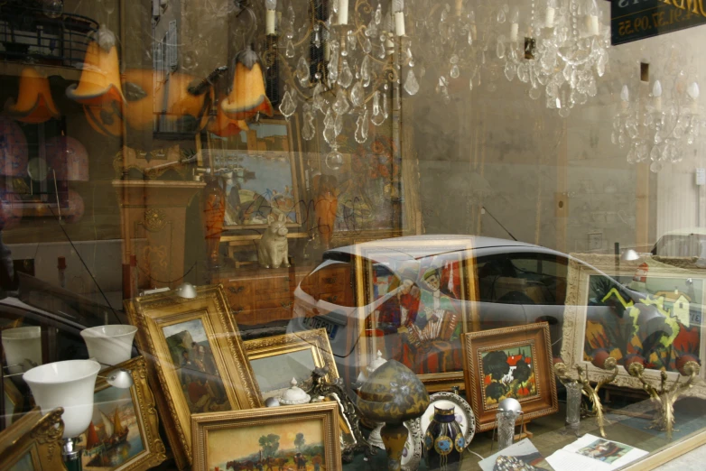 an image of the front window of a antiques store