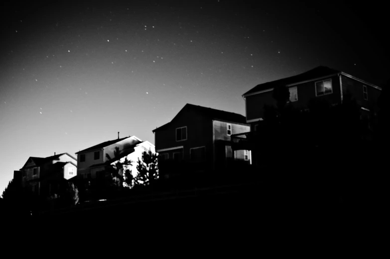 houses against the dark sky at night