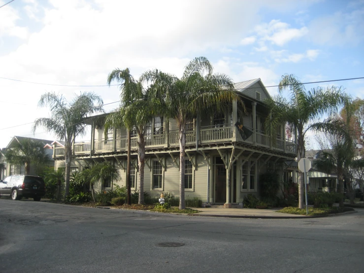 a tall home sitting on the corner of a street