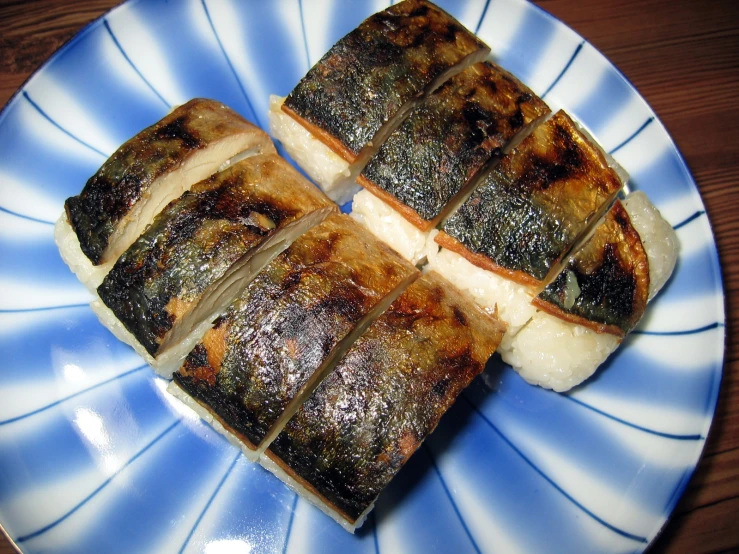 sliced pork and vegetable squares sit on a plate