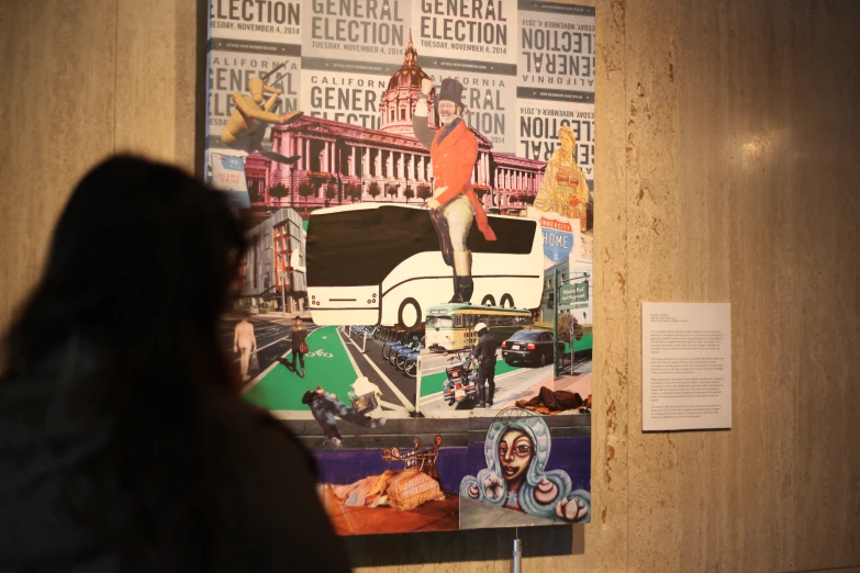 a woman looking at a display with pictures on it