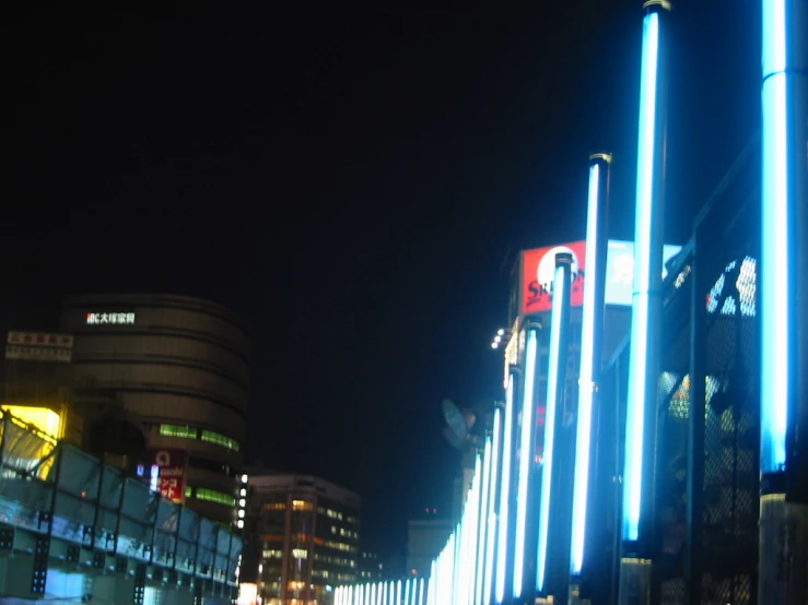 tall lights at night outside the building