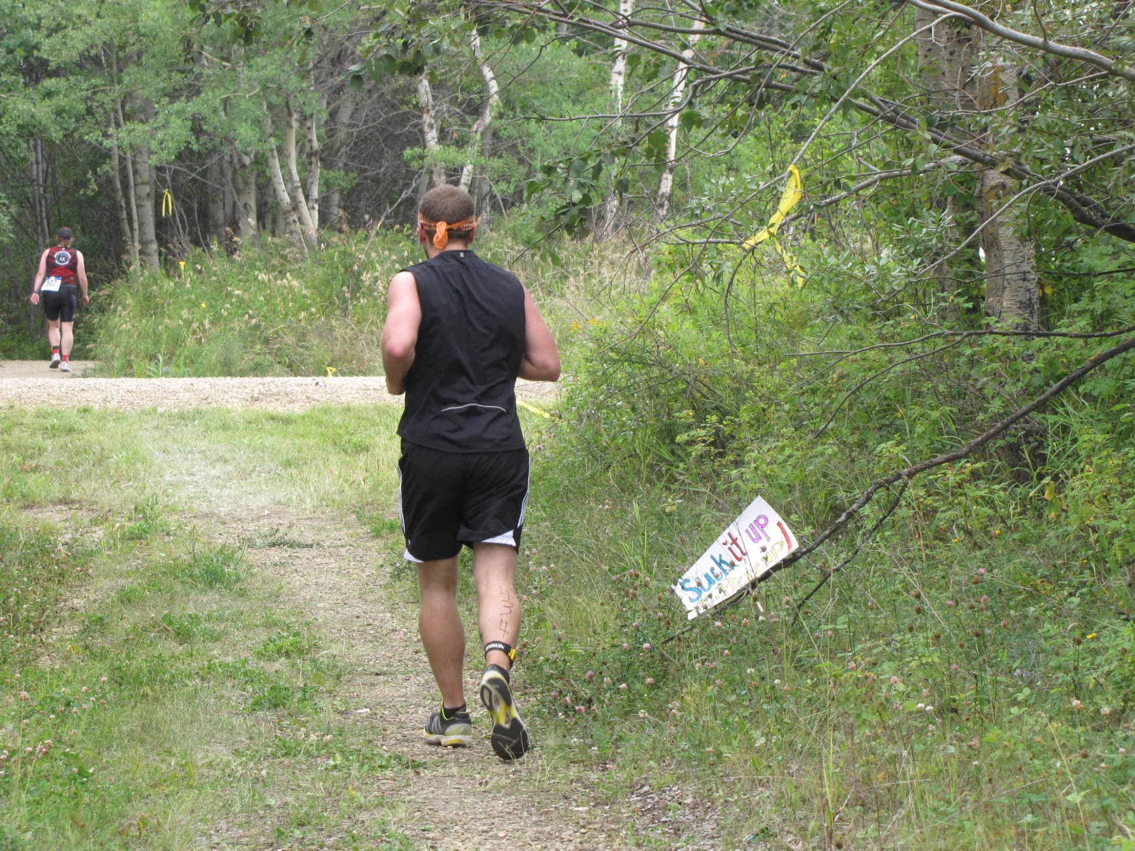 the trail goes through the woods to get to a finish line