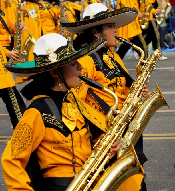 marching musicians with gold clothing on at parade