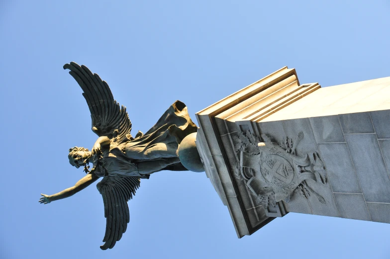 a statue with wings in the shape of an angel