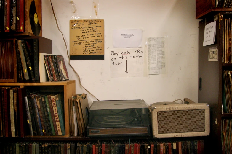 a room with a radio and books in it