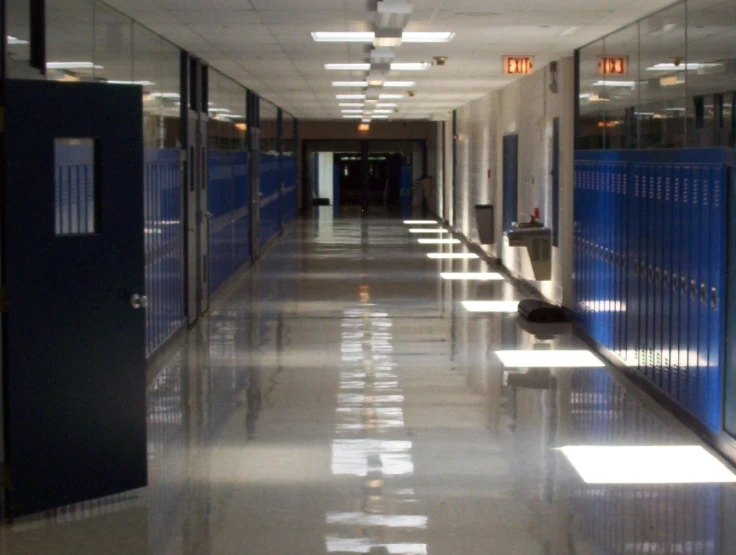 a hallway in an office building with lots of storage space