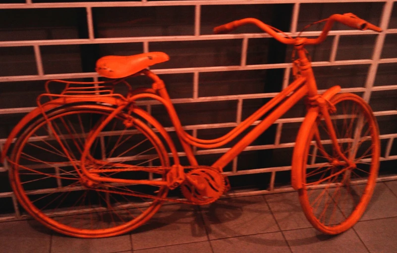 a bike leaning up against a wall near a wall