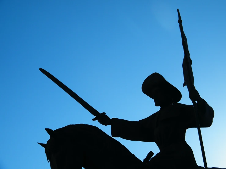 a statue is shown with a horse and a gun in its hand