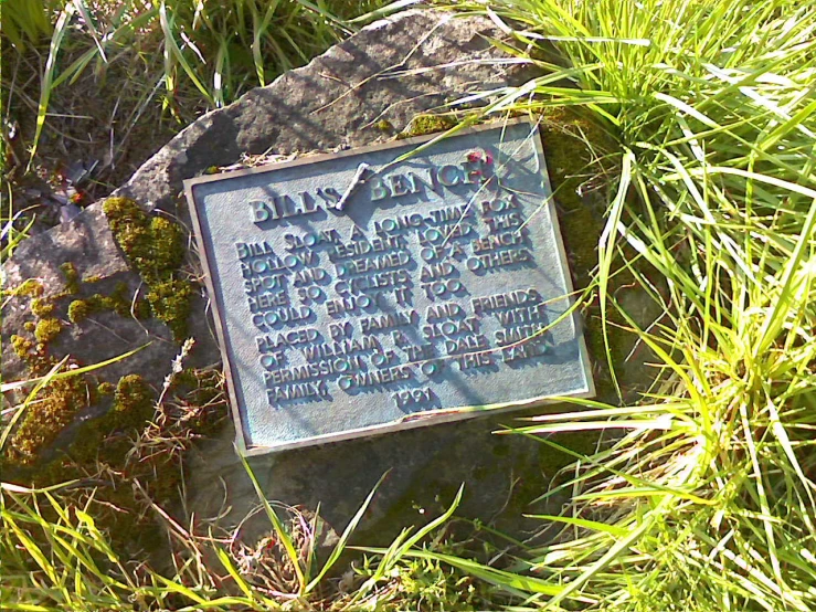 plaque in grass about the origin of the park