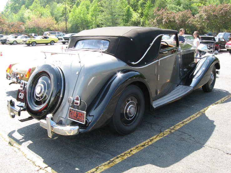 antique car with two people in it