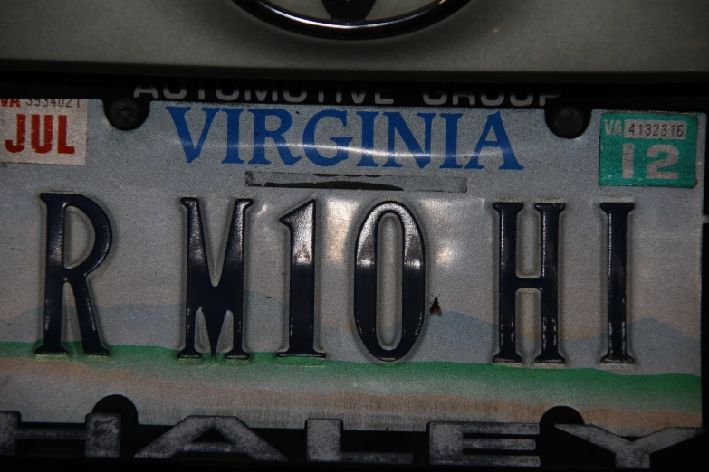 an old license plate that is missing the letters