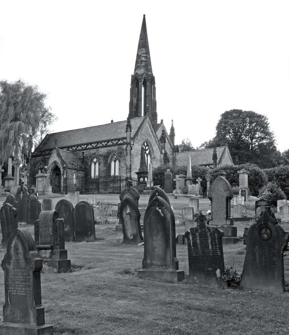 black and white po of old graveyard with spire