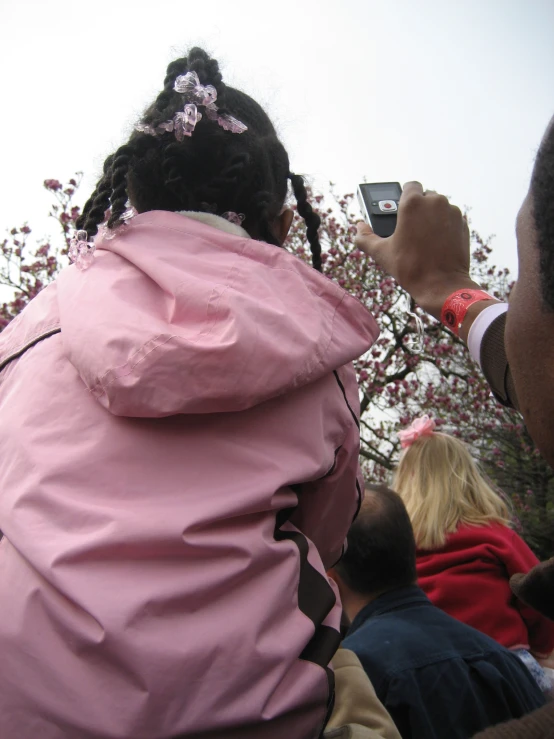 a woman is in the middle of taking a po with her phone