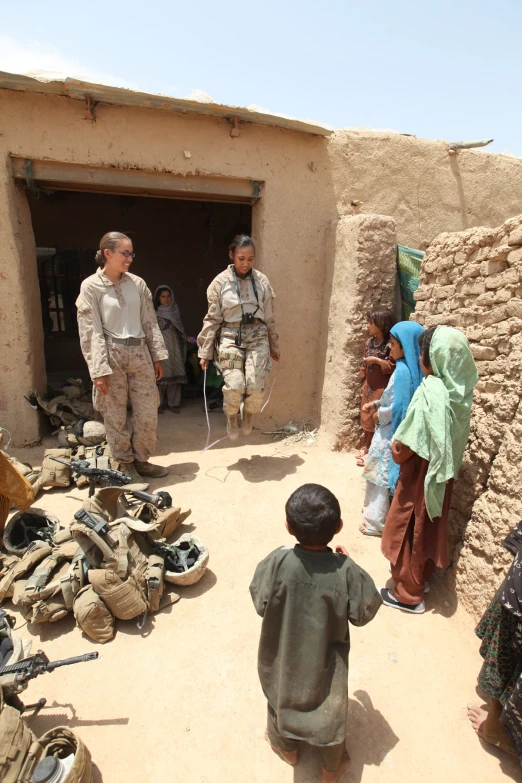 a group of people in military uniforms standing around