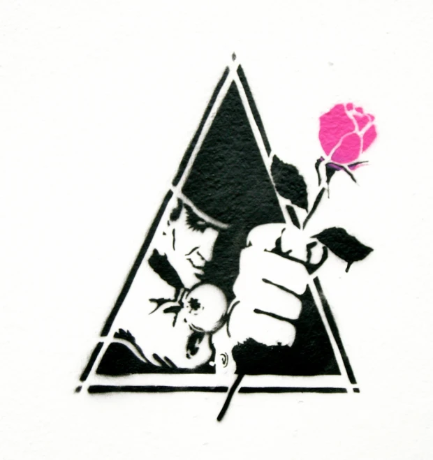 a hand holding a rose in the middle of a triangle