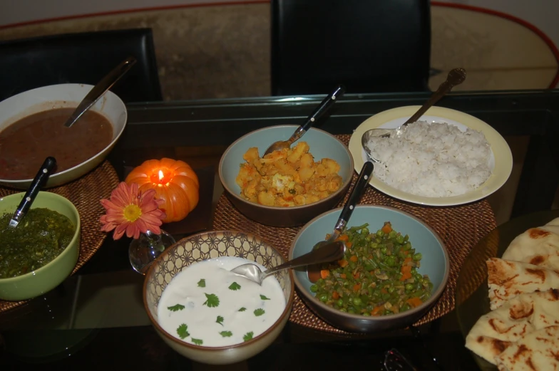 a group of plates of food and bowls