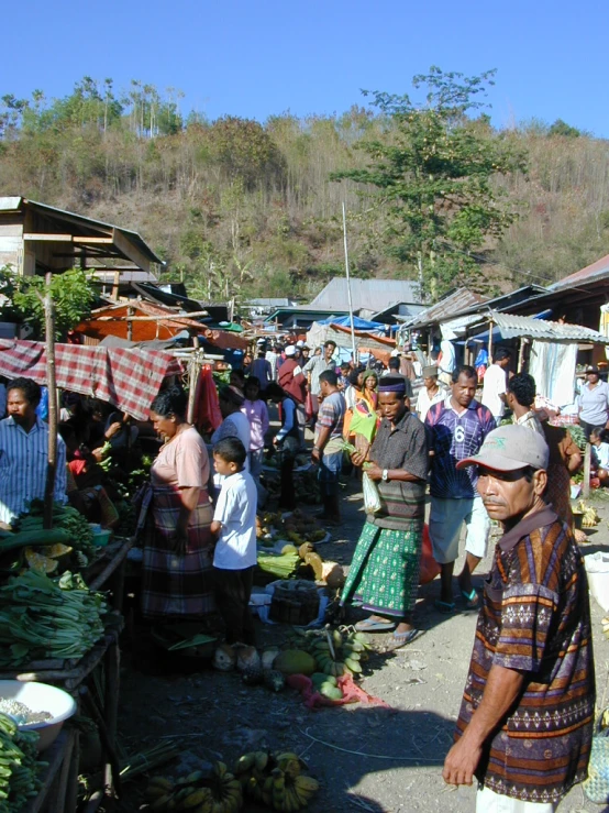 there are many people outside at a market