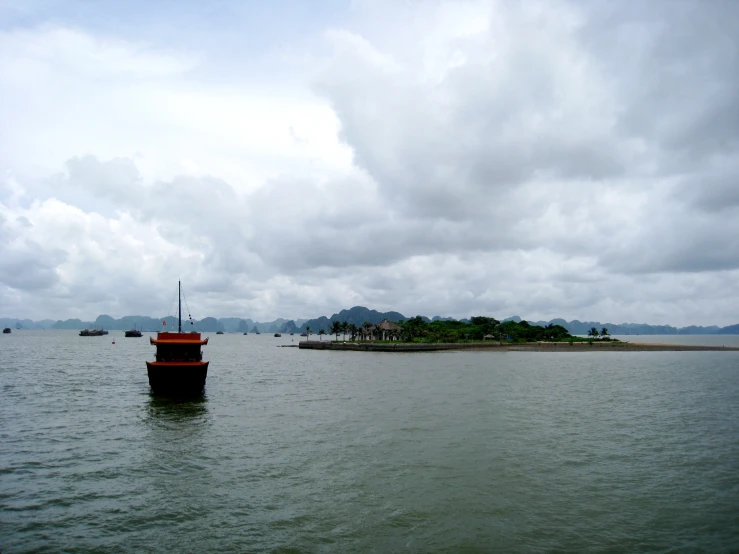 boats are in the water near an island