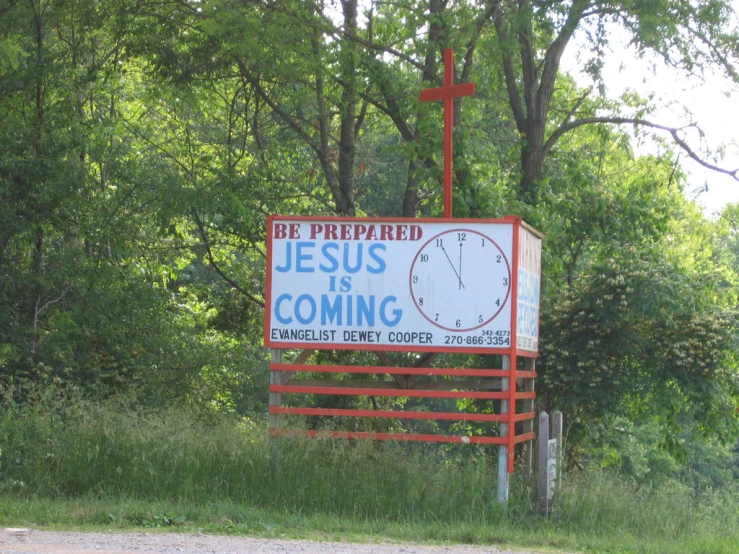 the church sign is in a wooded area