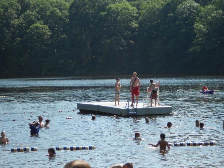 some people are at a public park in a lake