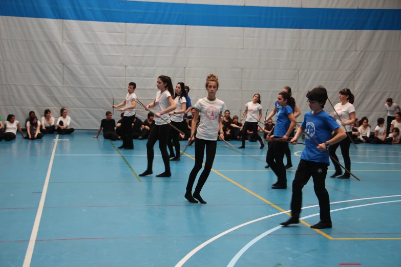 the girls are playing a game of badminton on the court