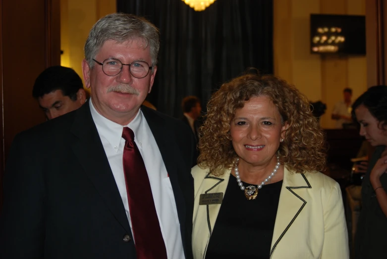 a man and a woman standing side by side