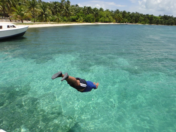 someone is swimming out in the clear water