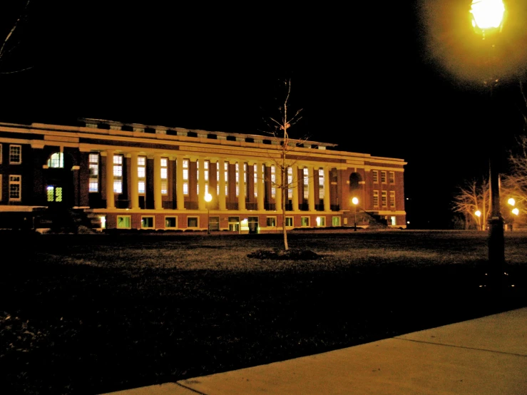 this building has some lights on and all the windows are lit