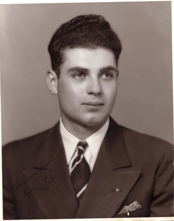 an old black and white portrait of a young man