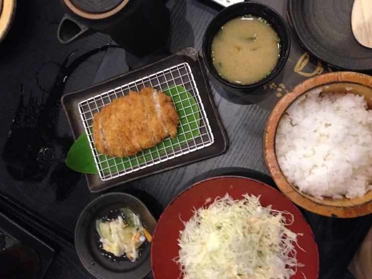 several different asian food items on a table