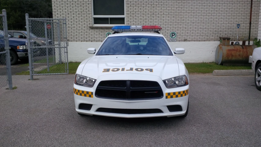 an officer car in front of a building