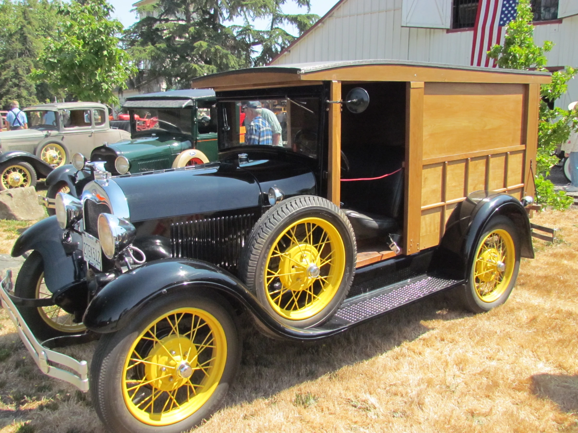 a model t ford is on display in a antique car show