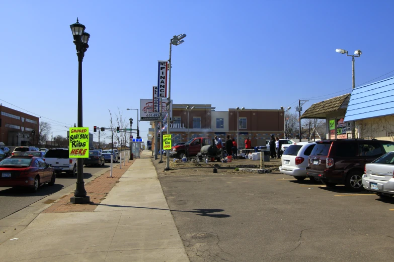 parked cars are in the lot of an open market