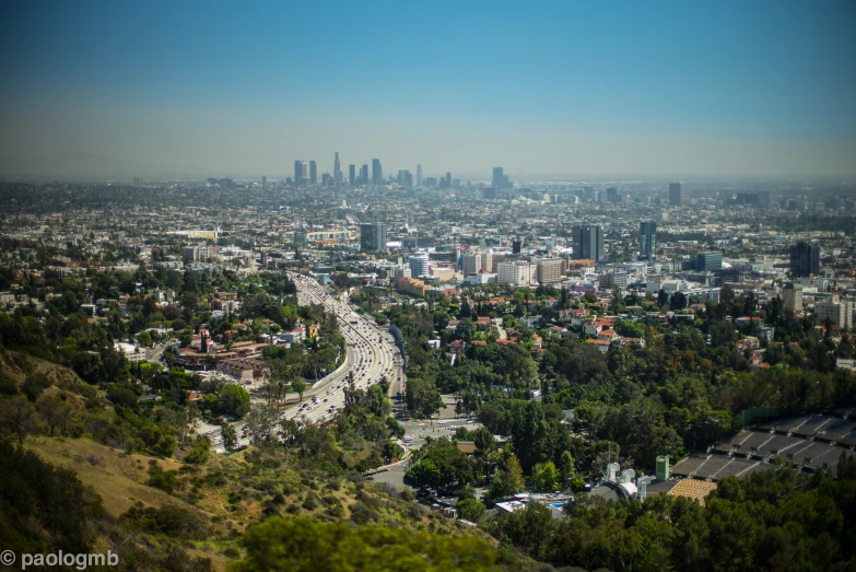 a view of an urban city from a hill