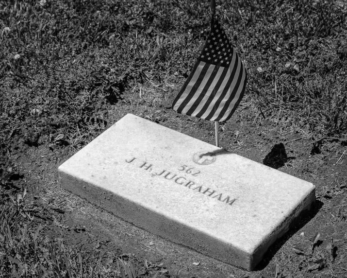 an american flag laying in the dark